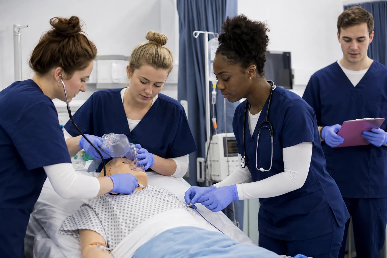 Healthcare-focused students discussing academic work in a clinical learning context.